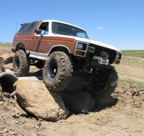 1981 Ford Bronco - This modified Ford Bronco navigates a challenging rocky terrain.