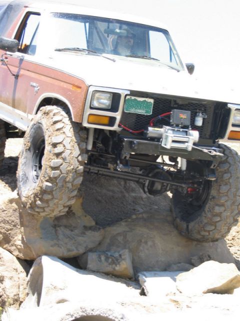 1981 Ford Bronco - This modified Ford Bronco is navigating a difficult rocky terrain.