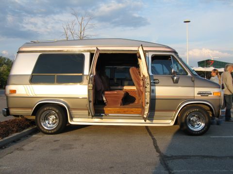 1992 Ford Crown Victoria - This conversion van features a two-tone paint scheme and a comfortable velour interior.