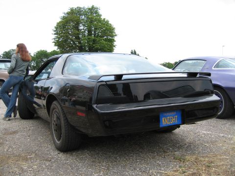1992 Ford Crown Victoria - Rear view of a black 1982 Pontiac Firebird Trans Am, a custom 'KNIGHT' license plate.