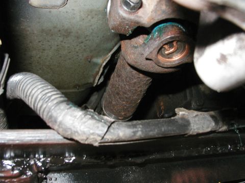 1994 Ford Bronco - Close-up view of a vehicle's driveshaft U-joint and protective boot.