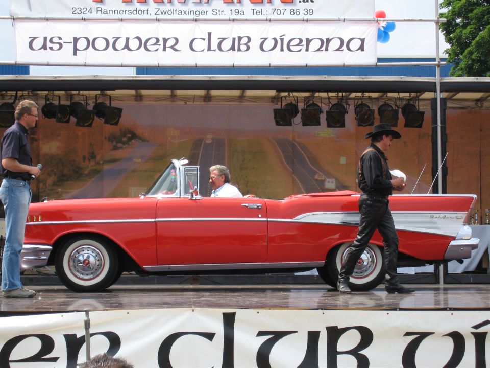 Red 1957 Chevrolet Bel Air convertible side view