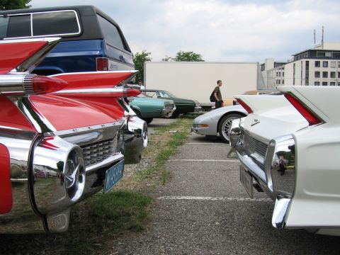 1992 Ford Crown Victoria - Rear view of a red 1959 Cadillac Eldorado, its iconic tail fins and chrome details.