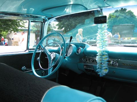1992 Ford Crown Victoria - Interior view of a classic turquoise Chevrolet Bel Air, highlighting its distinctive dashboard and steering wheel.