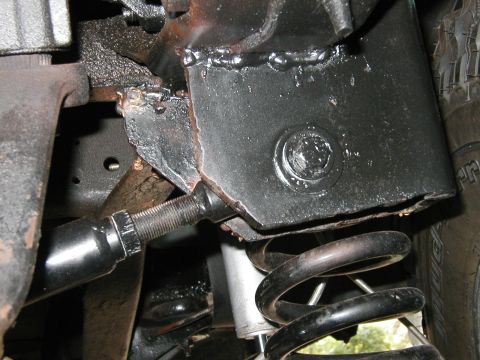 1994 Ford Bronco - Detail of vehicle undercarriage showing suspension components and frame modifications.