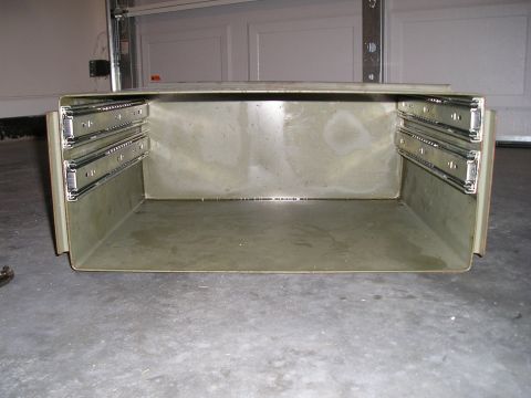 1996 Ford Bronco - A metal toolbox with drawer slides is shown in a garage setting.