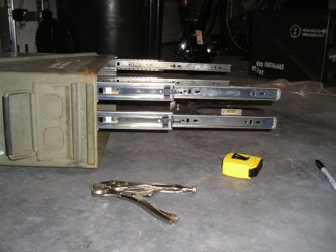 1996 Ford Bronco - An ammo can has been modified with drawer slides, with tools laid out nearby for the project.