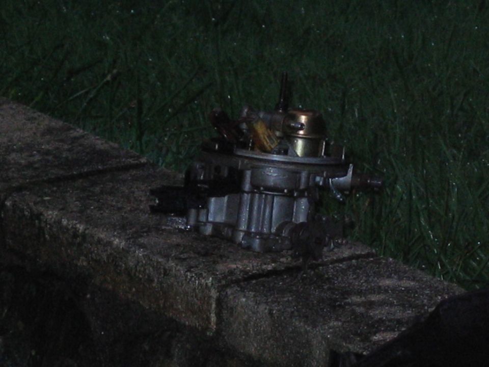 Carburetor resting on a stone ledge