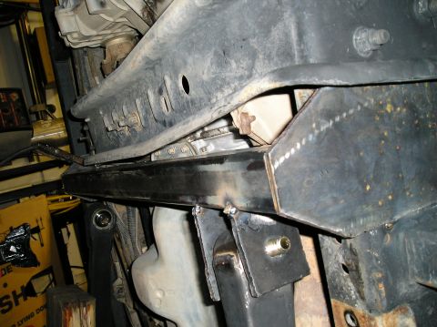 1993 Ford Bronco - Custom metal fabrication is visible on the vehicle's undercarriage, including welded brackets and a new crossmember.