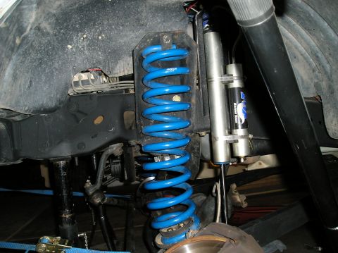 1993 Ford Bronco - Vehicle suspension components including blue coil springs and Fox shocks are visible.