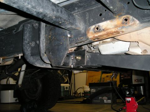 1993 Ford Bronco - Close-up of the undercarriage shows suspension components and frame structure, with some signs of wear.