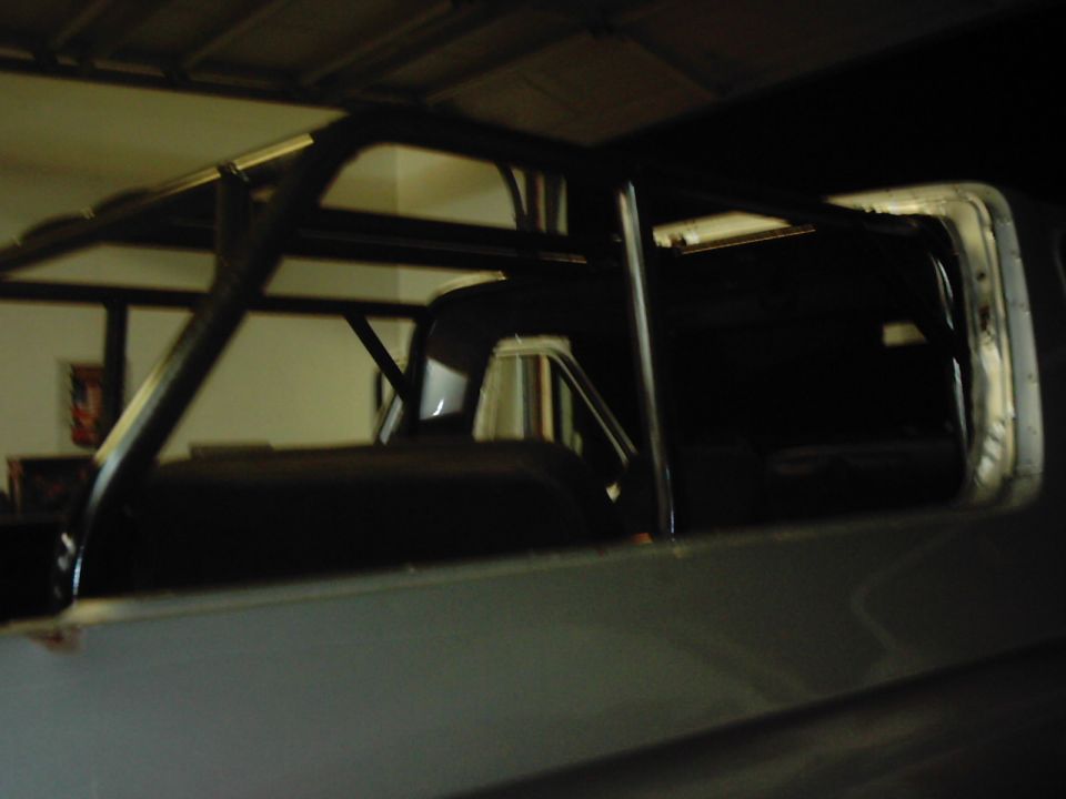 Roll cage structure inside a vehicle's interior, viewed from the side