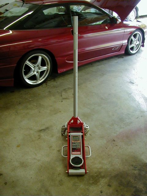 1994 Ford Probe - Red 1994 Ford Probe GT coupe with hood open, parked next to a floor jack.