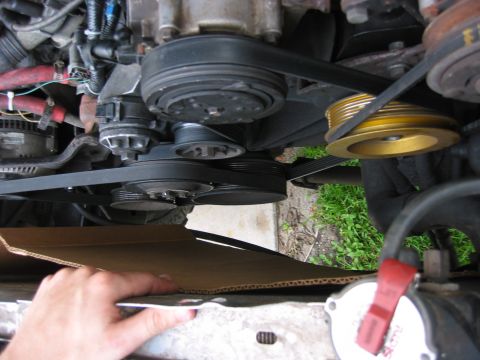 1989 Ford Bronco - Using cardboard to make a template to cut the shroud of the dual fans around the radiator hoses etc.