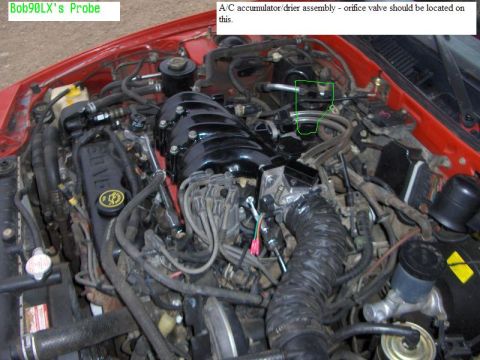 1992 Ford Probe - The image shows a close-up view of a car's engine bay, highlighting the V6 engine and associated parts.
