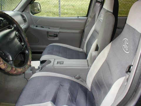 1979 Ford Bronco - Interior view of a car's front seats and dashboard area.