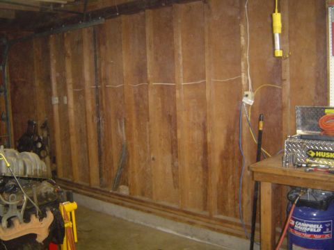 1989 Ford Bronco - A garage interior scene shows engine parts and a workbench, not a 1989 Ford Bronco.