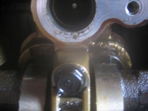 1993 Ford Probe - A detailed view of an engine part, showing mechanical components and some text.
