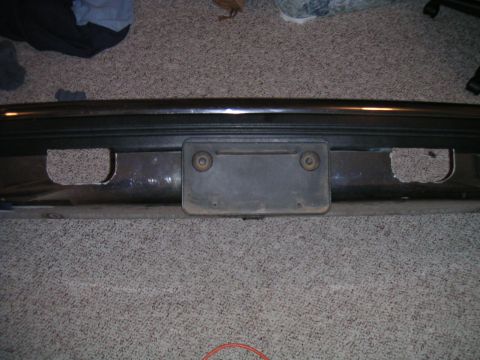 1994 Ford Bronco - This image shows a rear bumper with a license plate mount and cutouts, likely for recovery points.