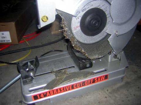 1995 Ford Bronco - A 14-inch abrasive cut-off saw is shown with its metal cutting disc and safety guard.