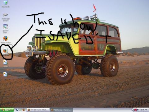 1986 Ford Bronco - A heavily modified off-road vehicle with a wood-paneled body sits on a sandy landscape.
