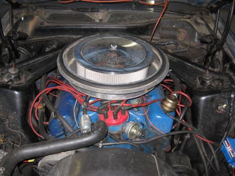 1972 Ford Mustang - Close-up view of a Ford V8 engine, a chrome air cleaner and prominent red spark plug wires.