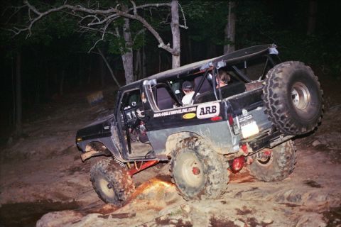 1978 Ford Bronco - This modified 1978 Ford Bronco navigates a challenging rocky terrain, its off-road capabilities.