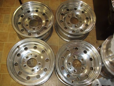 1994 Ford Bronco - Set of four aluminum alloy wheels, likely for a truck or SUV, with a 5x5.5 bolt pattern visible.