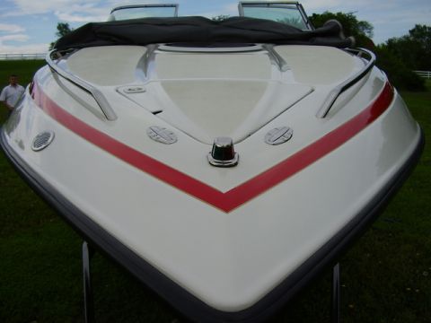 1997 Crownline 266 CCR - Front view of a white boat with a red stripe on the bow.