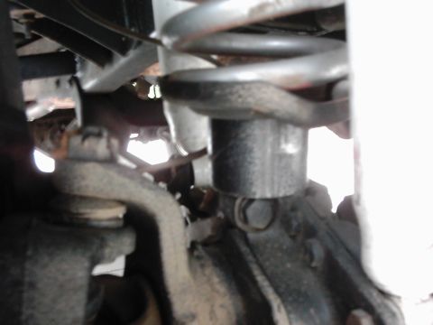 1978 Ford Bronco - Detail shot of vehicle suspension components, the Supermotors.net logo in the lower right corner.