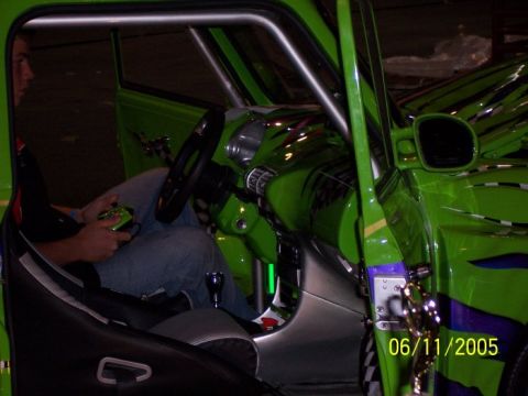 2005 Ford Focus - Custom green car interior with racing seat and aftermarket steering wheel. Date stamp shows 06/11/2005.