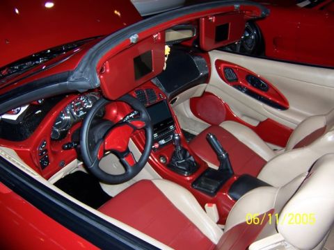 2005 Ford Focus - Interior view of a red and tan car with custom detailing on the dashboard and seats, dated 06/11/2005.