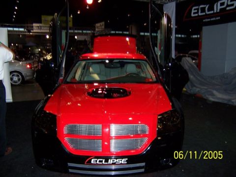 2005 Ford Focus - Customized car with gullwing doors displayed at an event, dated 06/11/2005.