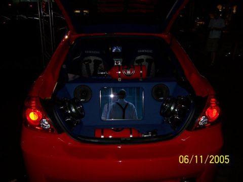 2005 Ford Focus - Customized 2005 Ford Focus trunk features audio equipment, Bride seats, and a reflective surface.