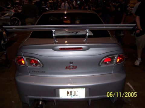 2005 Ford Focus - This silver sedan, identified by its Chevrolet badge and large rear spoiler, does not match the claimed 2005 Ford Focus.