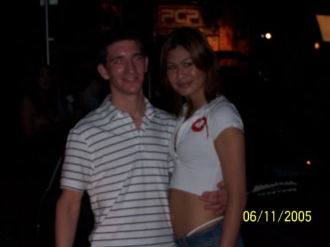 2005 Ford Focus - A couple poses for a photo at an event, with a date stamp indicating it was taken on June 11, 2005.
