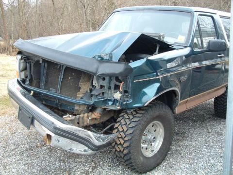 1994 Ford Bronco - This 1994 Ford Bronco sustained significant front-end damage, affecting the hood and grille.