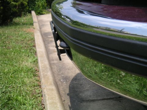 1994 Ford Bronco - Close-up of the front bumper on a 1994 Ford Bronco, a chrome bumper and a license plate bracket.