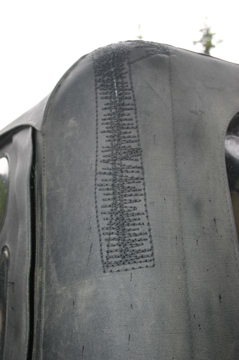 2003 Jeep TJ - Detail of a soft top seam, showing the stitching pattern on the fabric.