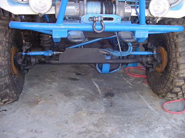 Off-road vehicle front axle, suspension, and winch assembly with large tires