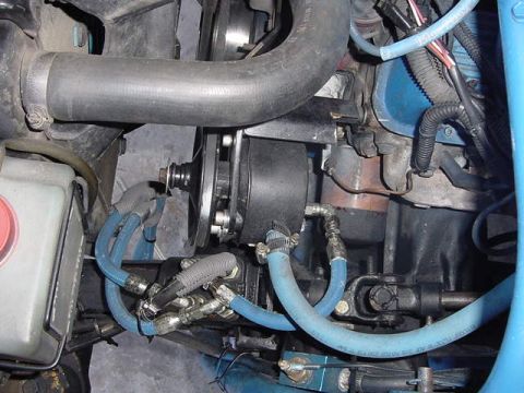 1971 Ford Bronco - Close-up view of engine bay components, including hoses and the engine block, with visible text from a watermark.