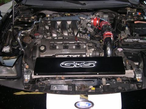 1997 Ford Probe - Engine bay view showing the engine and various components, with a GTS cover.