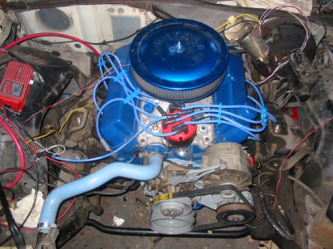 1985 Ford LTD Crown Victoria - Engine bay components including blue valve covers and air cleaner are visible.