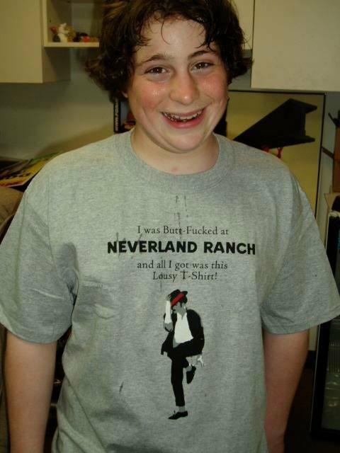 1983 Ford F-250 - A person smiles while wearing a t-shirt with controversial text and a graphic of Michael Jackson.