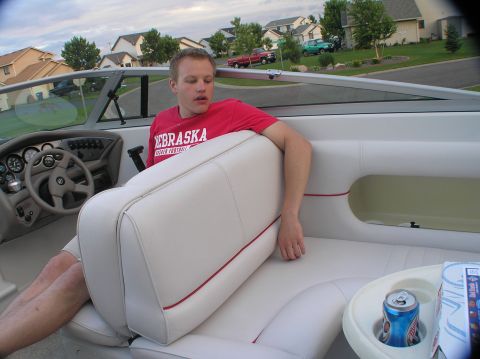 1997 Crownline 266 CCR - A man sits in the interior of a boat, with a dashboard visible.