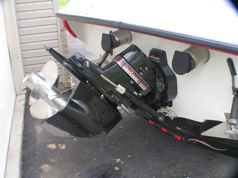 1997 Crownline 266 CCR - Close-up of a boat's stern drive system, a propeller and engine components.