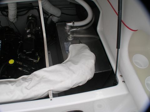 1997 Crownline 266 CCR - View of the engine compartment, showing the fuel tank and a protective white cover.