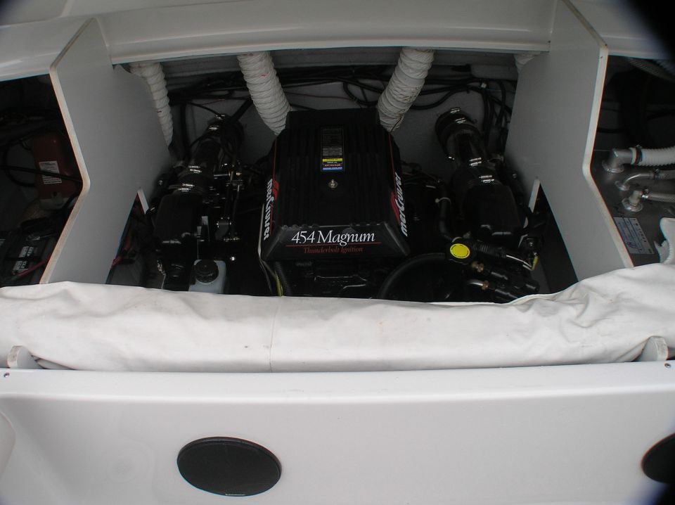 Black Mercury 454 Magnum marine engine in white fiberglass engine bay