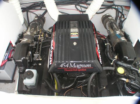 1997 Crownline 266 CCR - Close-up view of two powerful Mercruiser 454 Magnum engines, highlighting their Thunderbolt ignition systems.