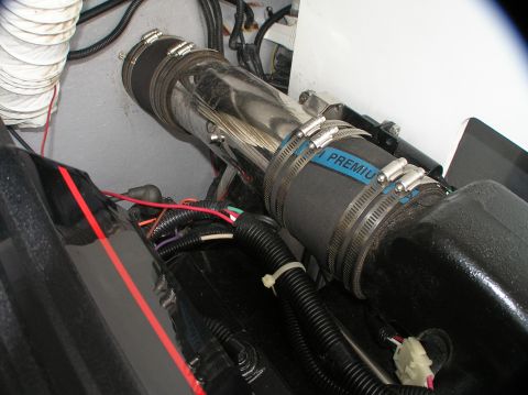 1997 Crownline 266 CCR - Close-up view of engine compartment components including hoses and wiring.